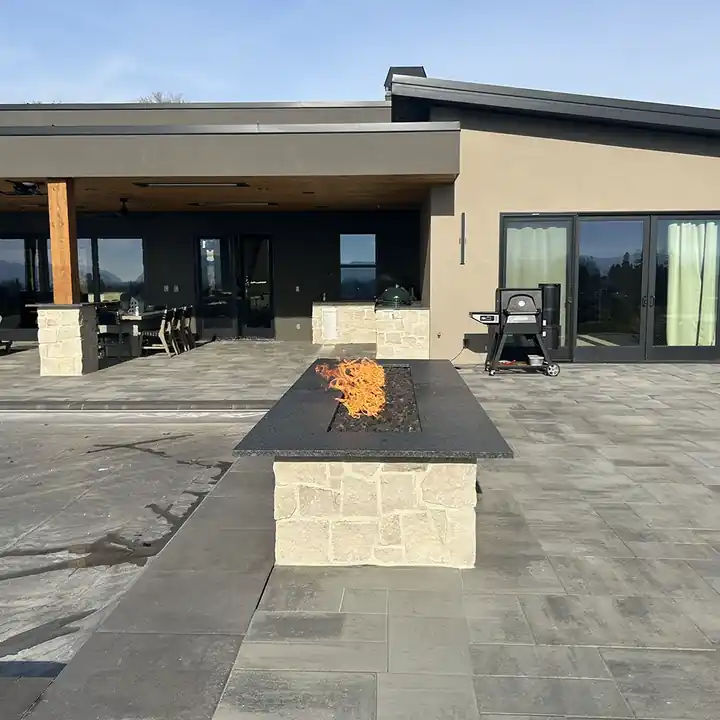 The same granite firepit seen from the patio