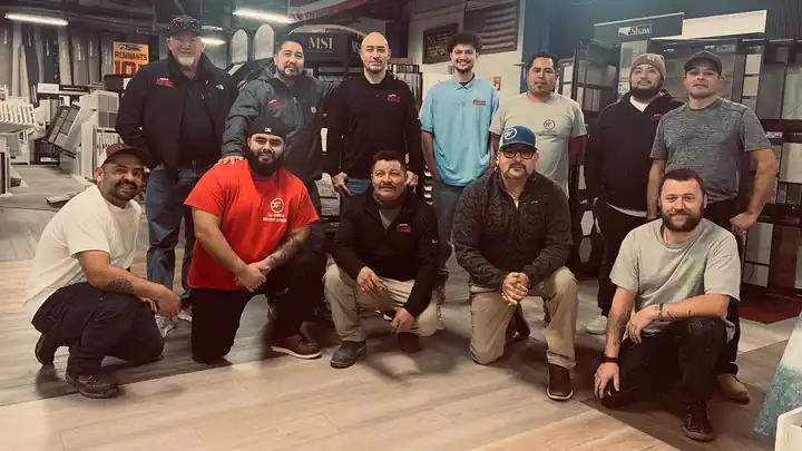 The All American Discount Flooring team gathered in the Yakima showroom